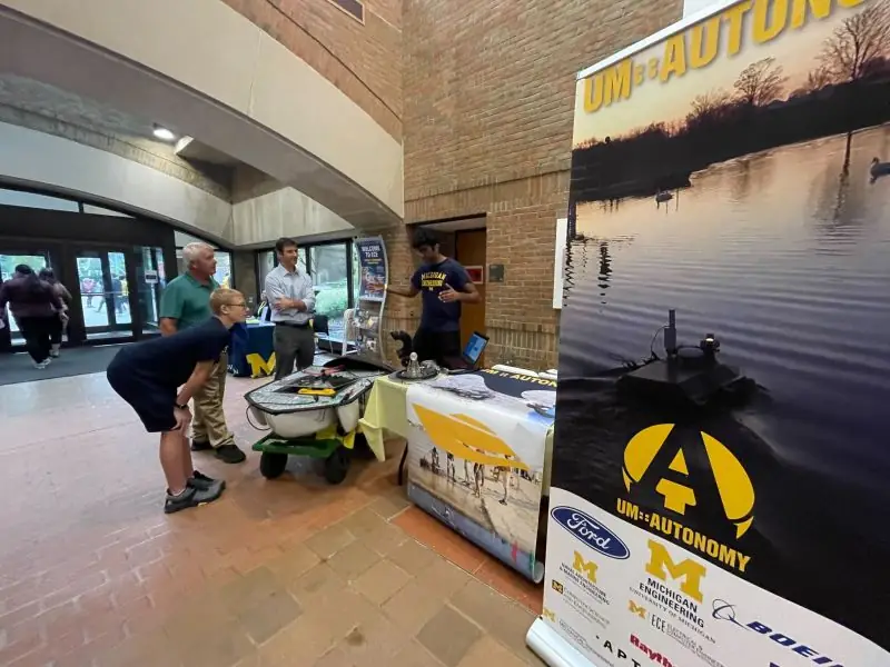 Michigan ECE alumni look at UM::Autonomy's boats